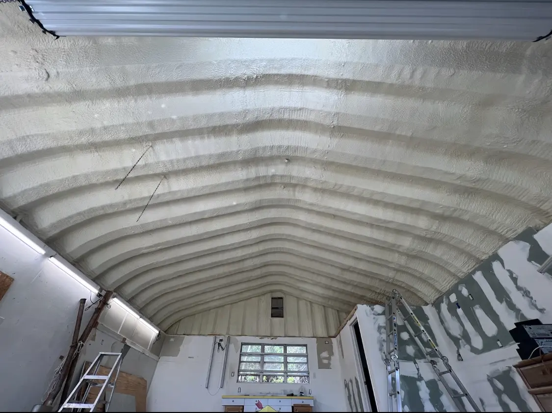 Spray polyurethane foam applied to the underside of a metal roof deck in Sweet Home